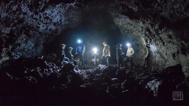 Adventurers discovering a natural cave